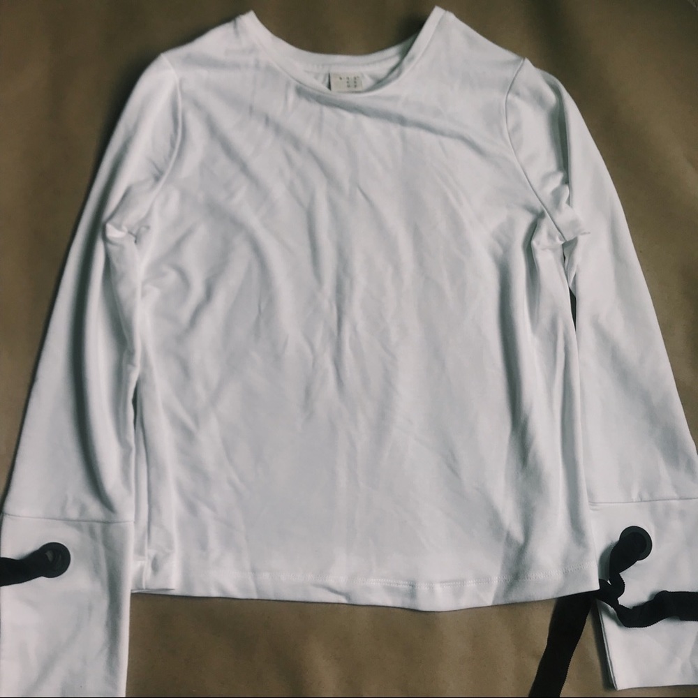 White sweater with tie details